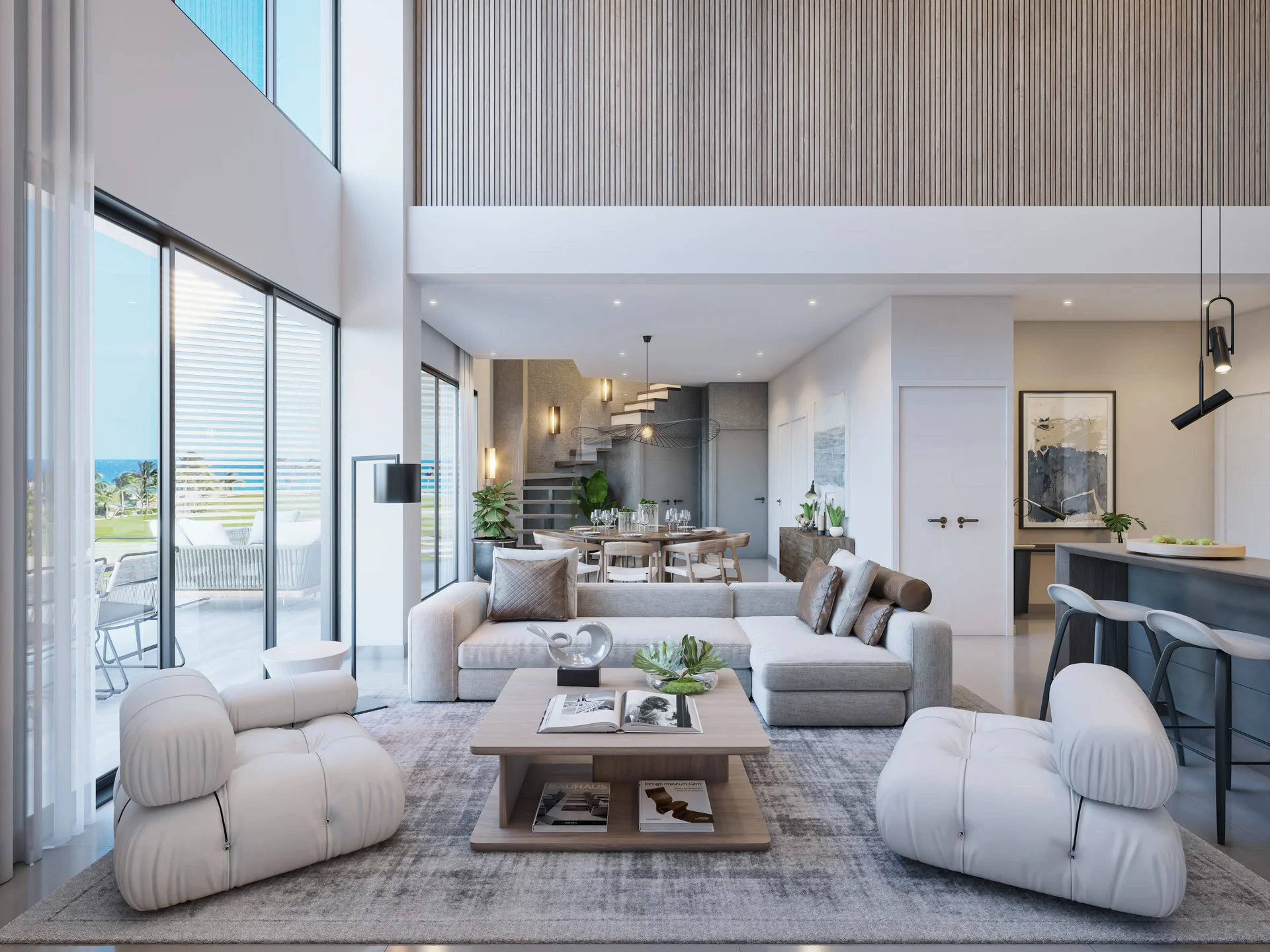 Grand salon de penthouse sous plafonds surélevés, à double orientation visuelle.
